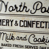 North Pole Creamery & Confectionary Metal Wall Art