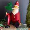 Santa Sitting with Tree Sculpture