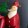 Santa Sitting with Tree Sculpture